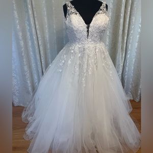 - Beautiful wedding ball gown in ivory with sheer back lace and sequins